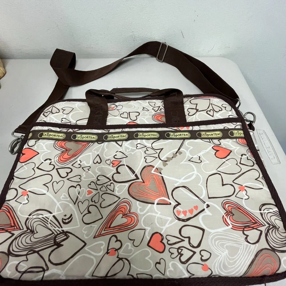 Le Sportsac computer messenger bag 11 x 15 hearts pink brown shoulder strap